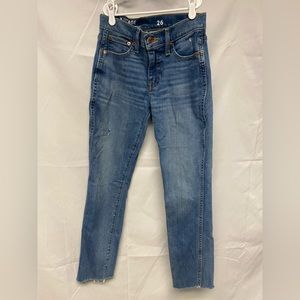 J. Crew vintage slim straight jeans in waist size 26. Distressed and raw hem.